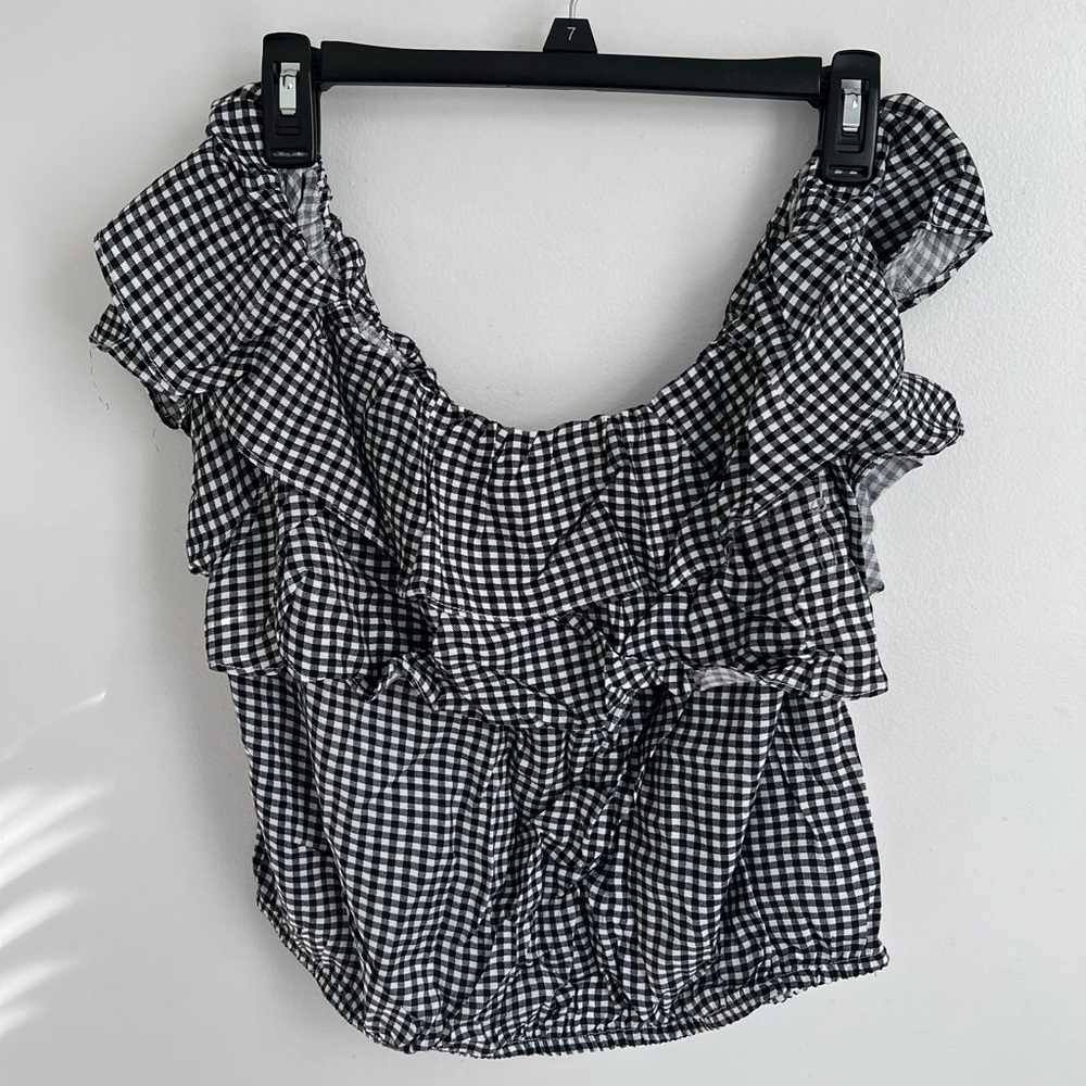 Black and White Sleeveless Ruffled Blouse